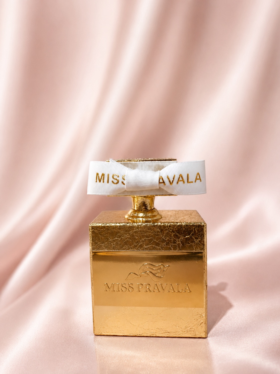 The Miss Pravala Signature Potion, gold-leafed glass on blush silk